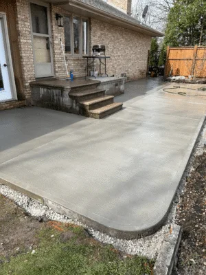 Excavated Windsor site with gravel base and framing prepared for concrete foundation.