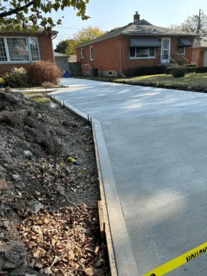 Large excavation with gravel base and reinforced framing for concrete foundation in Windsor.
