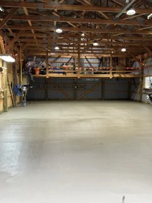 Excavated site in Windsor with gravel base and wooden framing for concrete foundation work.